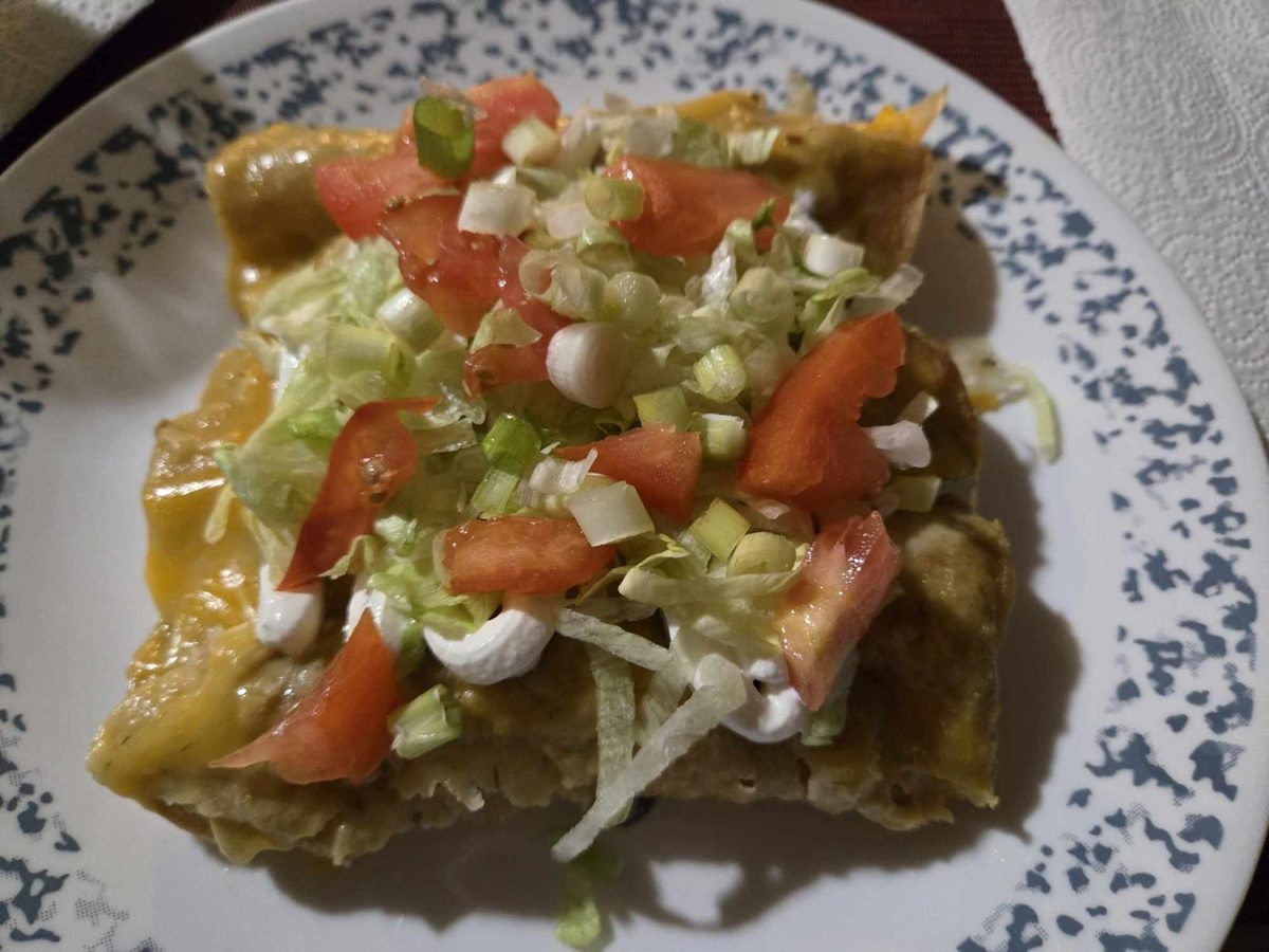 Loaded enchiladas with lettuce and tomato