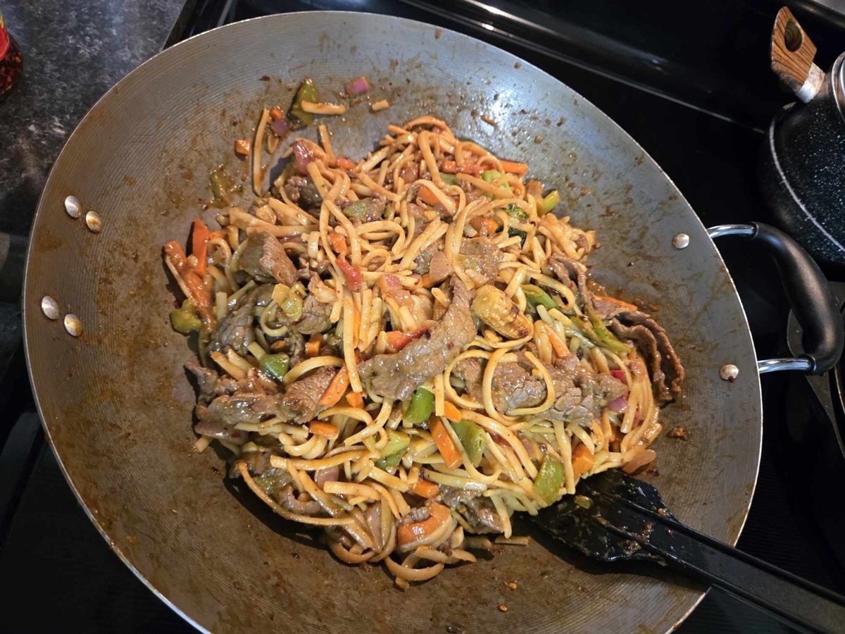 Beef with chili pepper Thai noodles in a wok